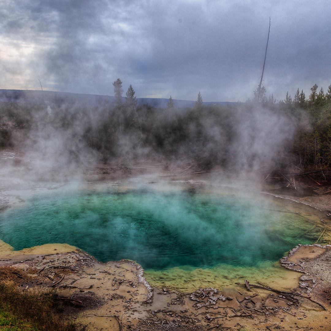 Hot springs with steam rising up