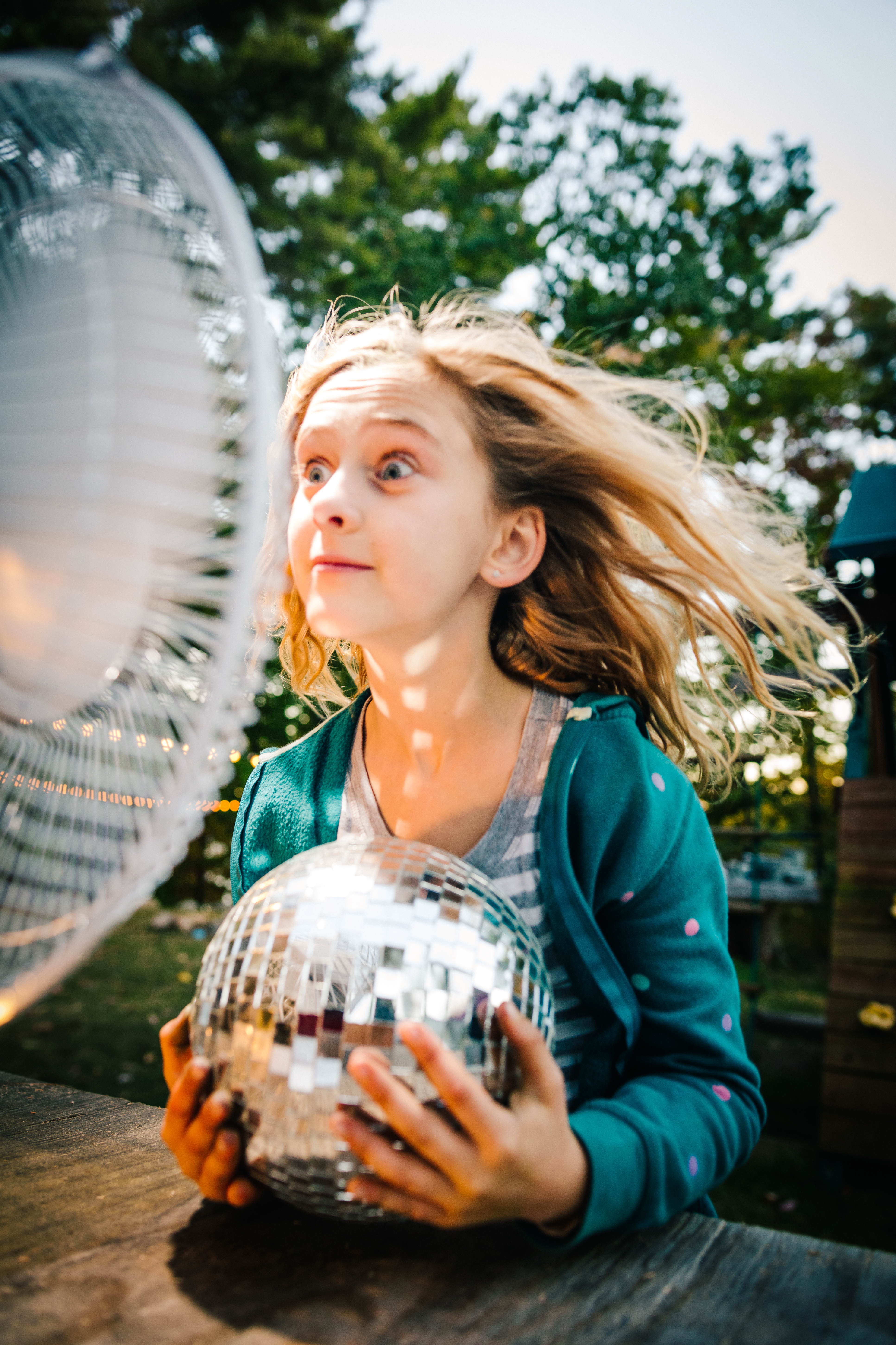 Girl staying cool with fan