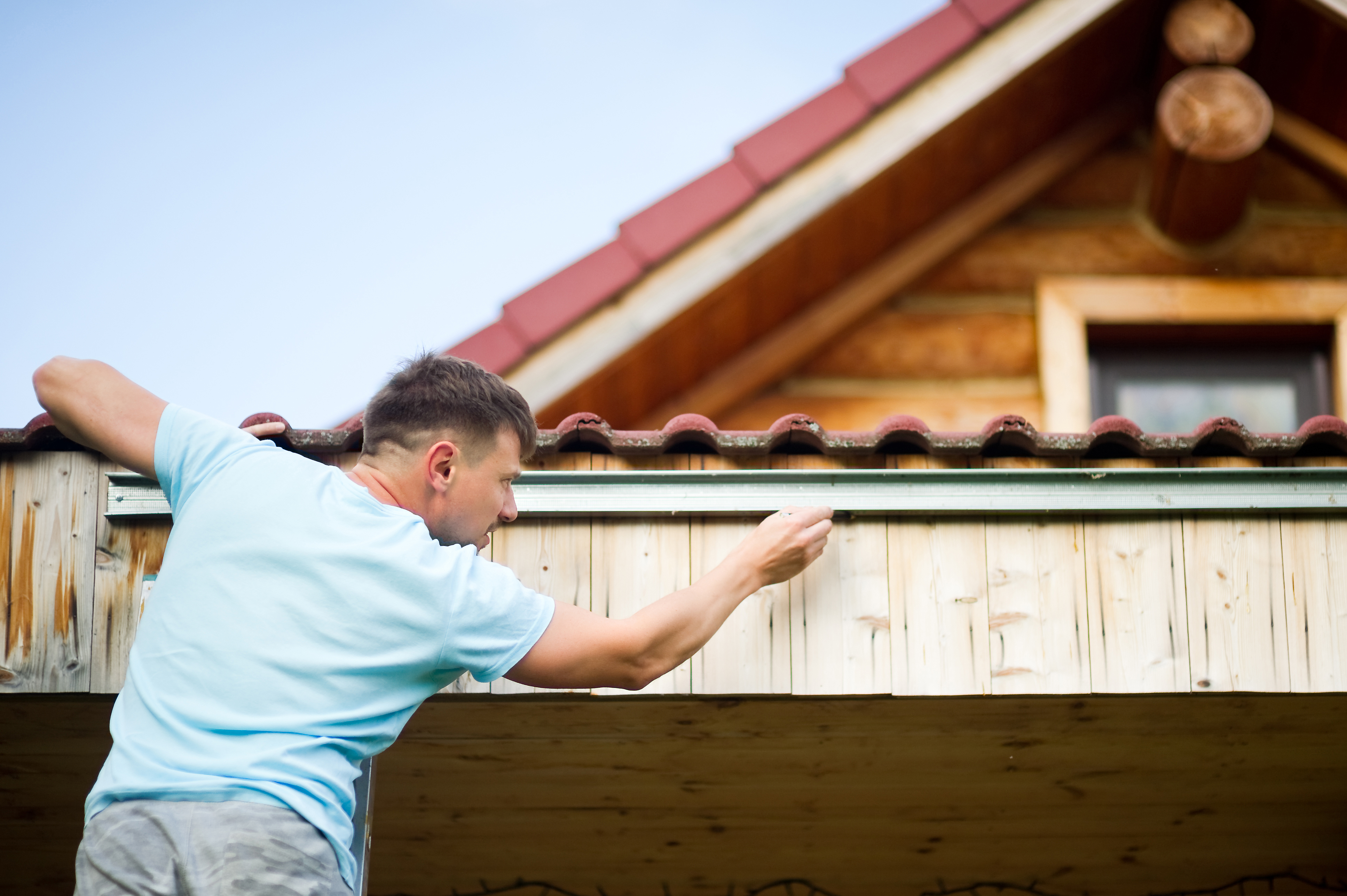 Man repairing leaking roof