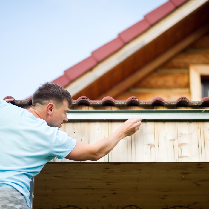 Man repairing leaking roof
